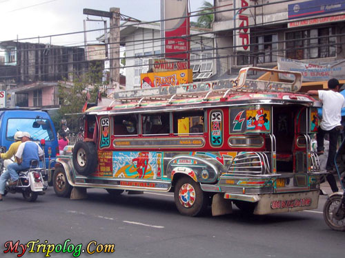 jeepney on manila streets,philippines,jeepney,manila traffic,public transportation