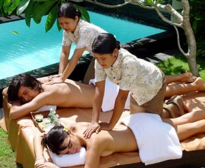 woman masseurs giving massage to vacationers