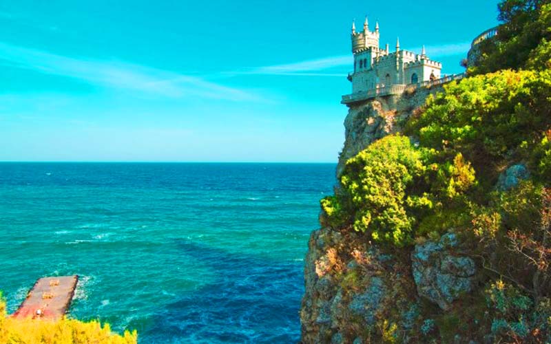 castle on cliff at sea coast